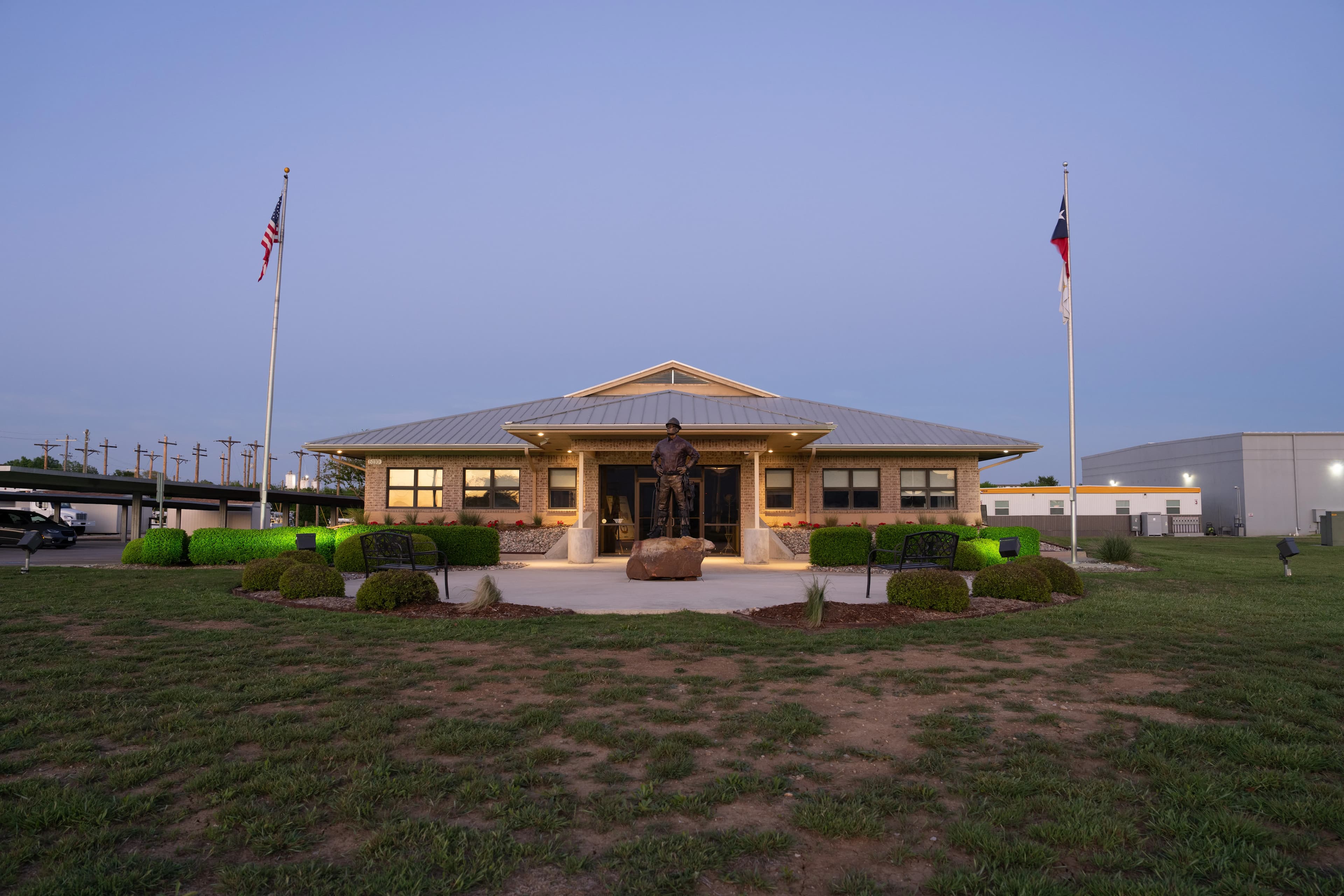NLC TX campus building entrance at dusk