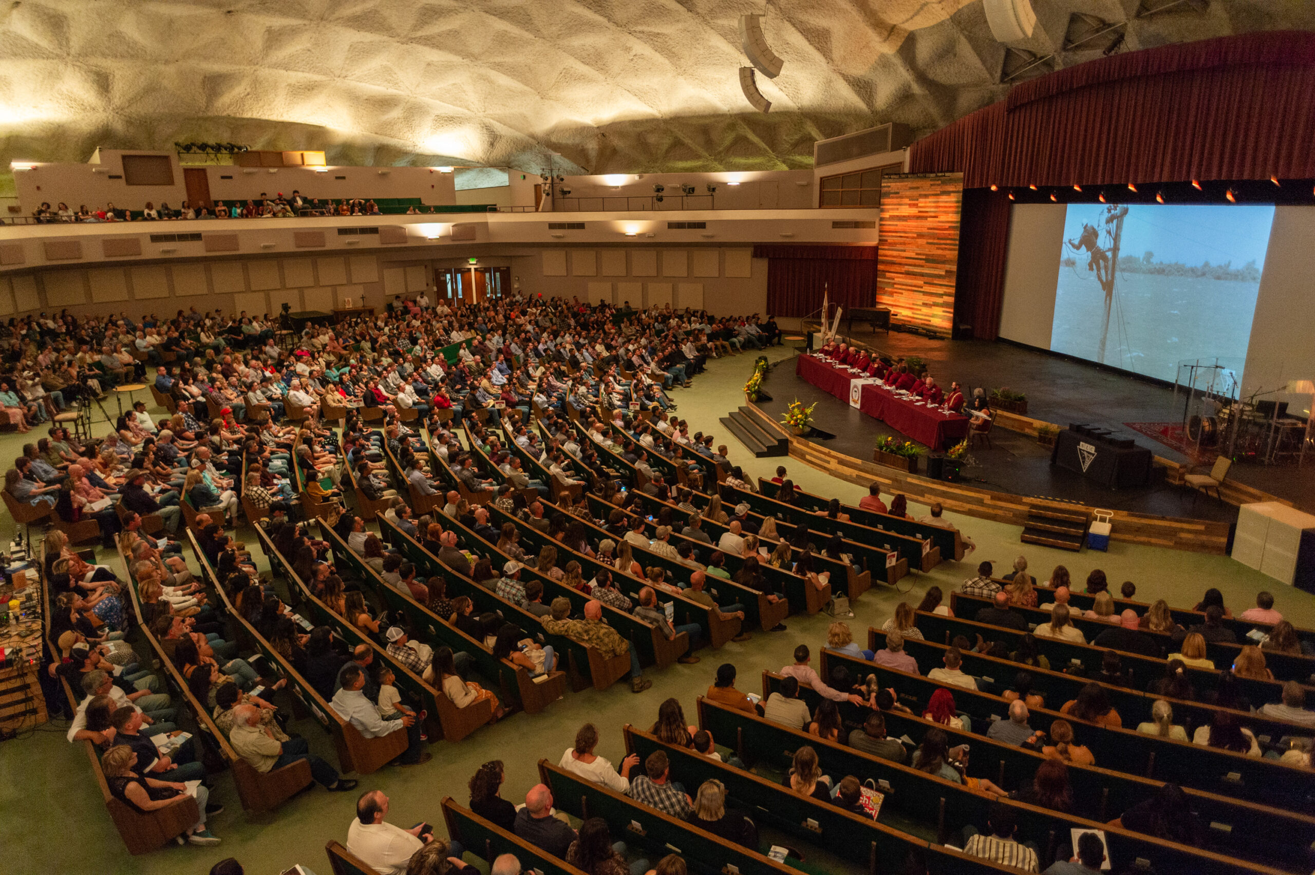 auditorium full of NLC students and families for the CA campus