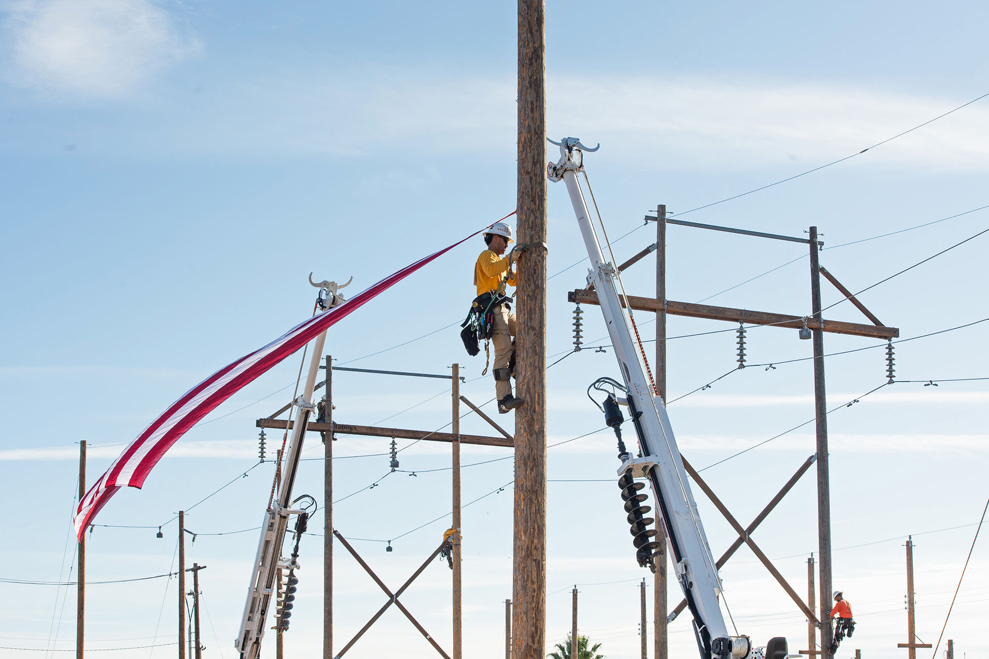 ELP student climbing a pole at rodeo.